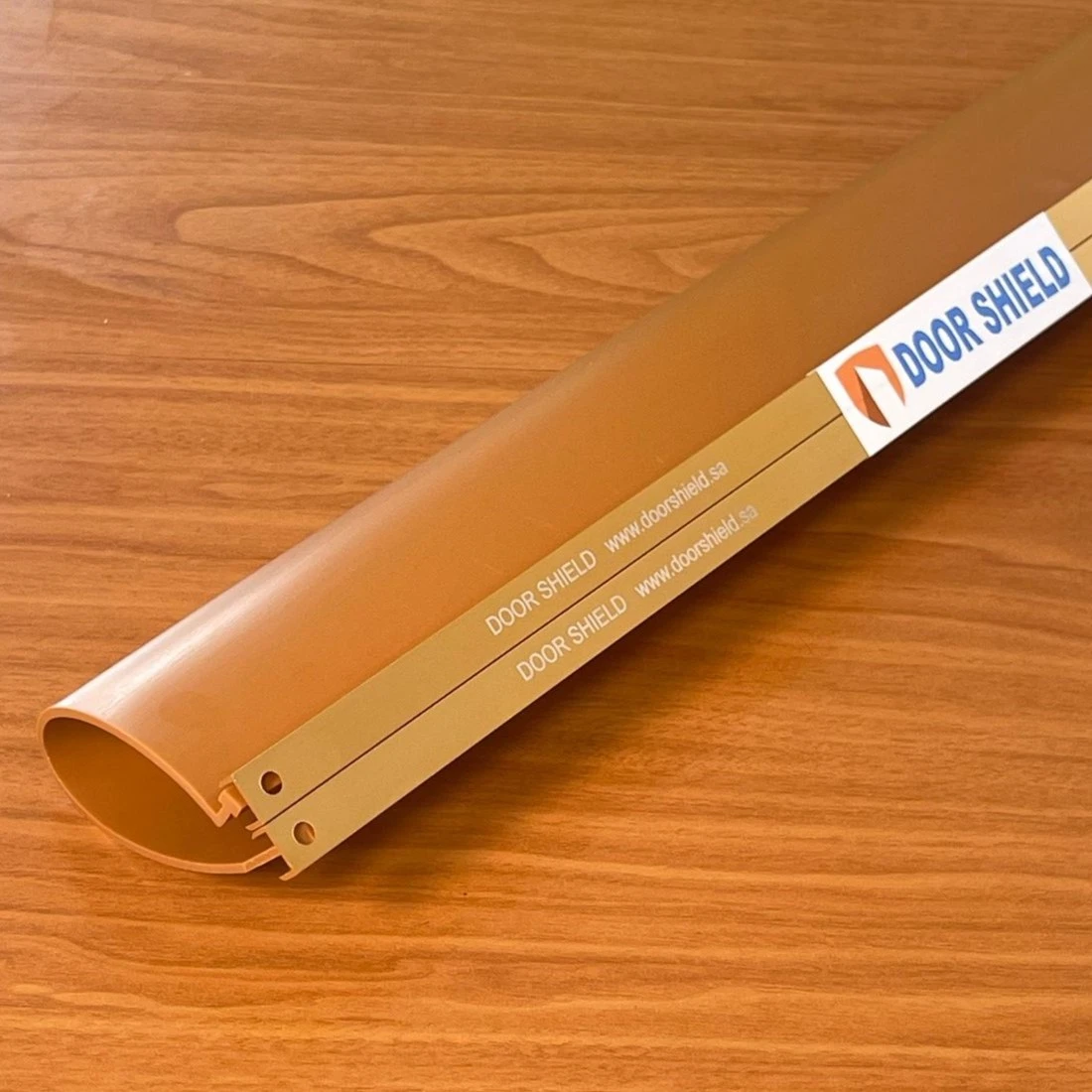 Light brown shield and brass square binder